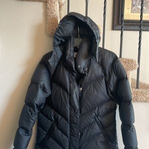 Nike sportswear black down jacket with removable hood.